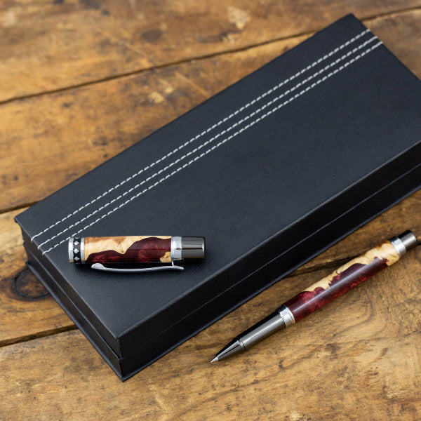 Black leatherette pen box with white stitching