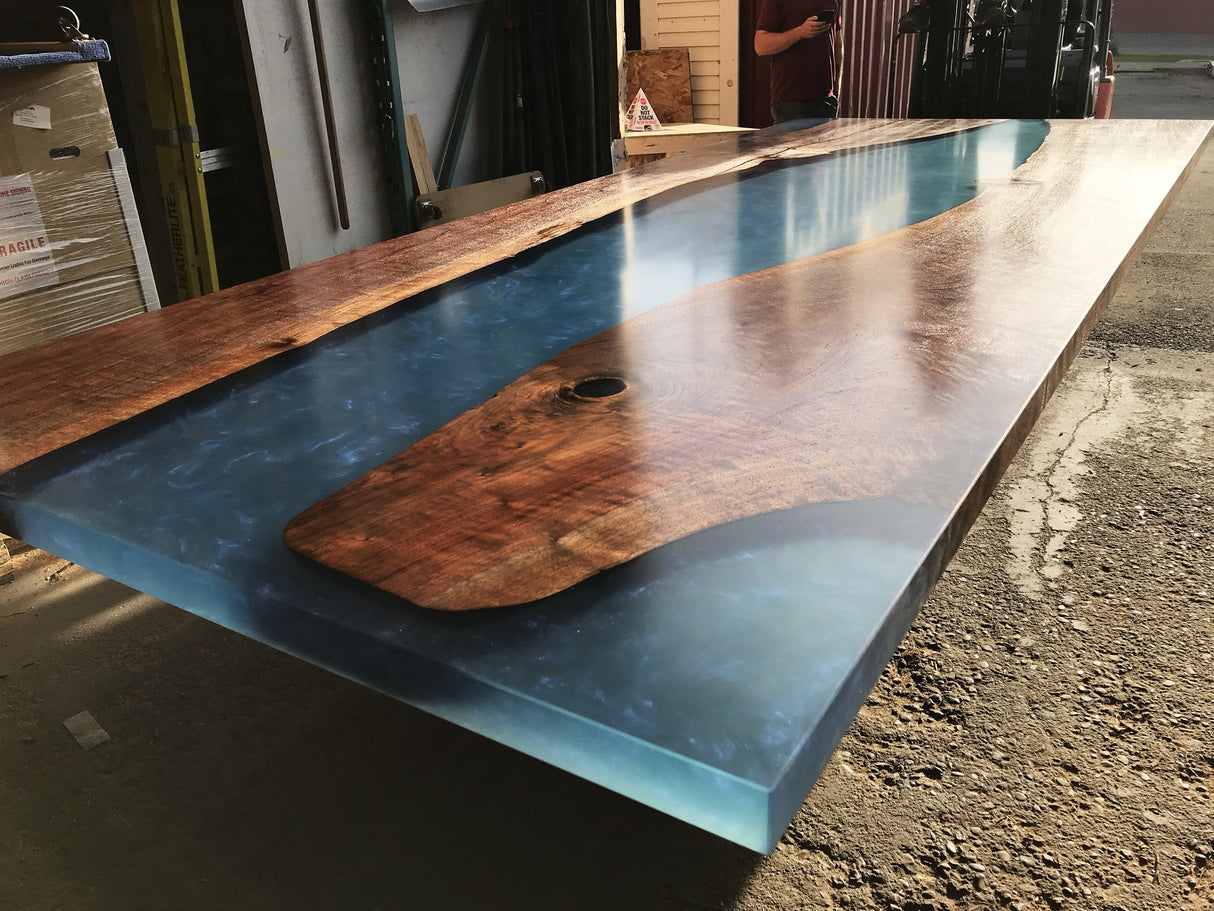 Claro Walnut and Transparent Metallic Blue Resin Dining Table